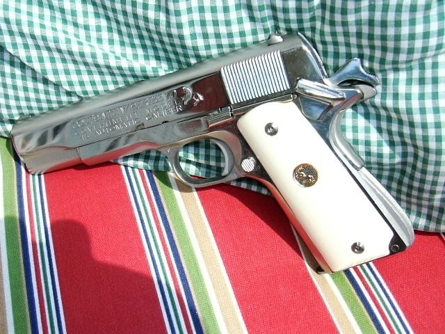 1911 Colt Government Model on colorful cushion
