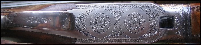 Abercrombie and Fitch 12 gauge shotgun, close up of forearm