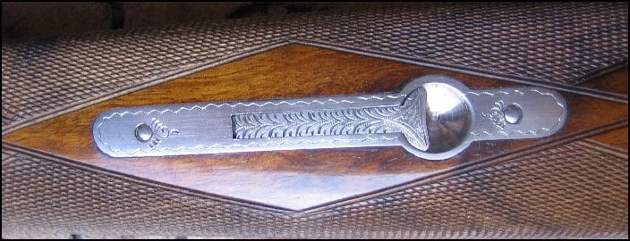 Abercrombie and Fitch 12 gauge shotgun, close up of forearm