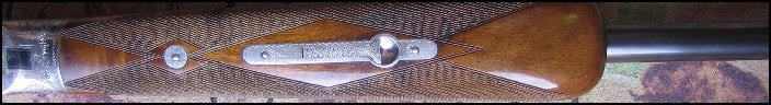 Abercrombie and Fitch 12 gauge shotgun, close up of forearm
