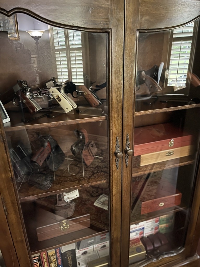 gun cabinet and guns