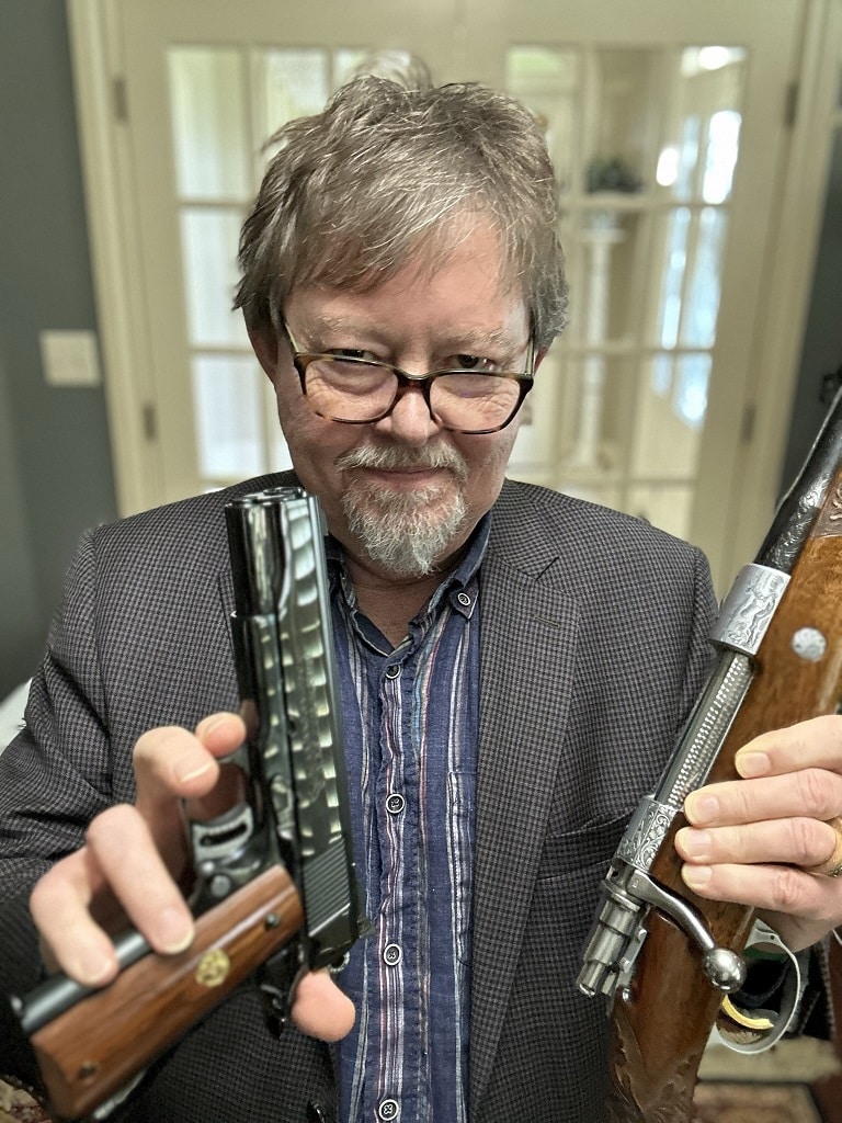 Author with Browning Bolt Action Rifle and Colt Presentation Gold Cup