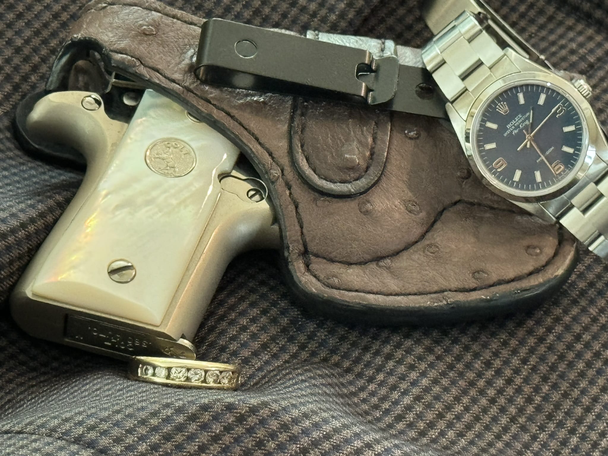 Colt Mustang, Rolex and wedding ring 