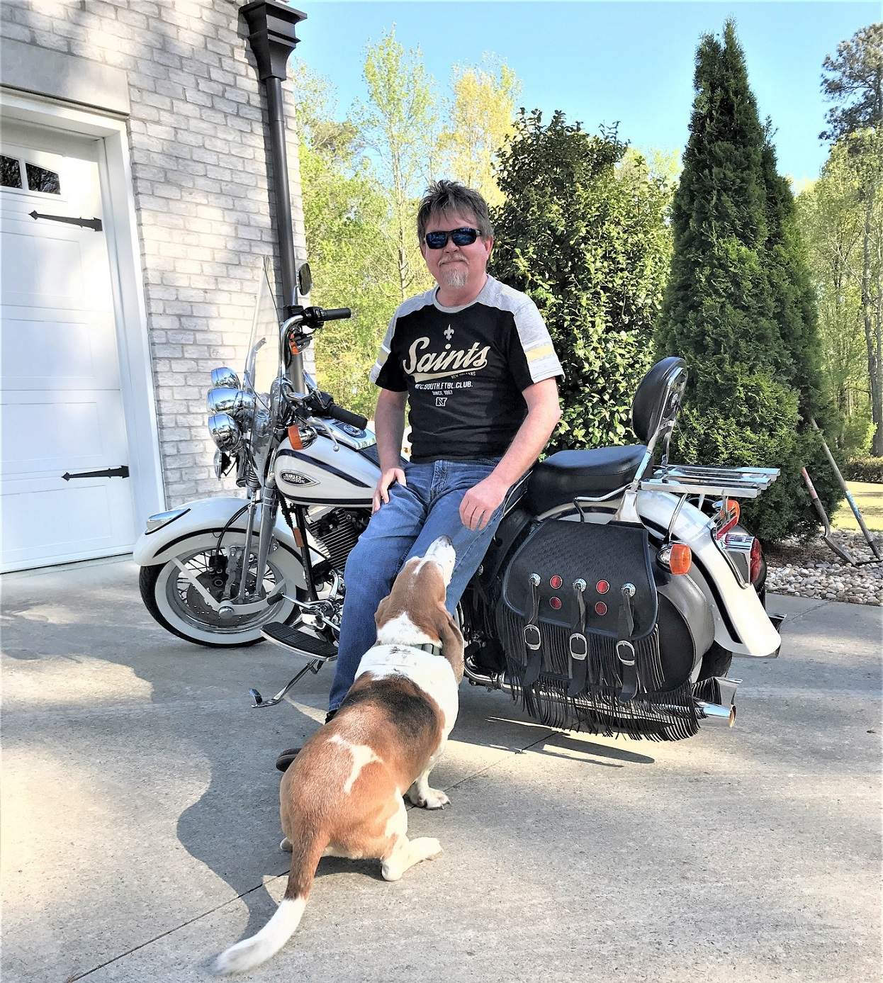 Greg with his hound dog and old Harley
