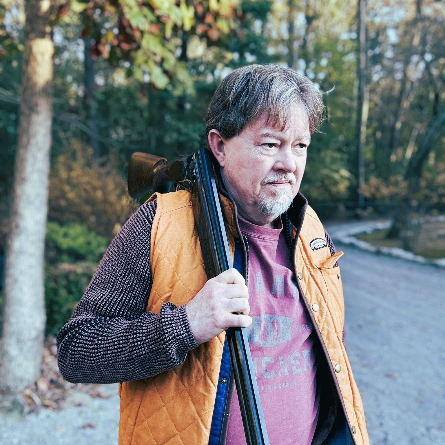 Author holding Citori Gran Lightning Over and Under Shotgun on Walking Trail