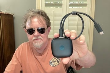 author wearing Aviator sunglasses and holding Synology Bee Drive