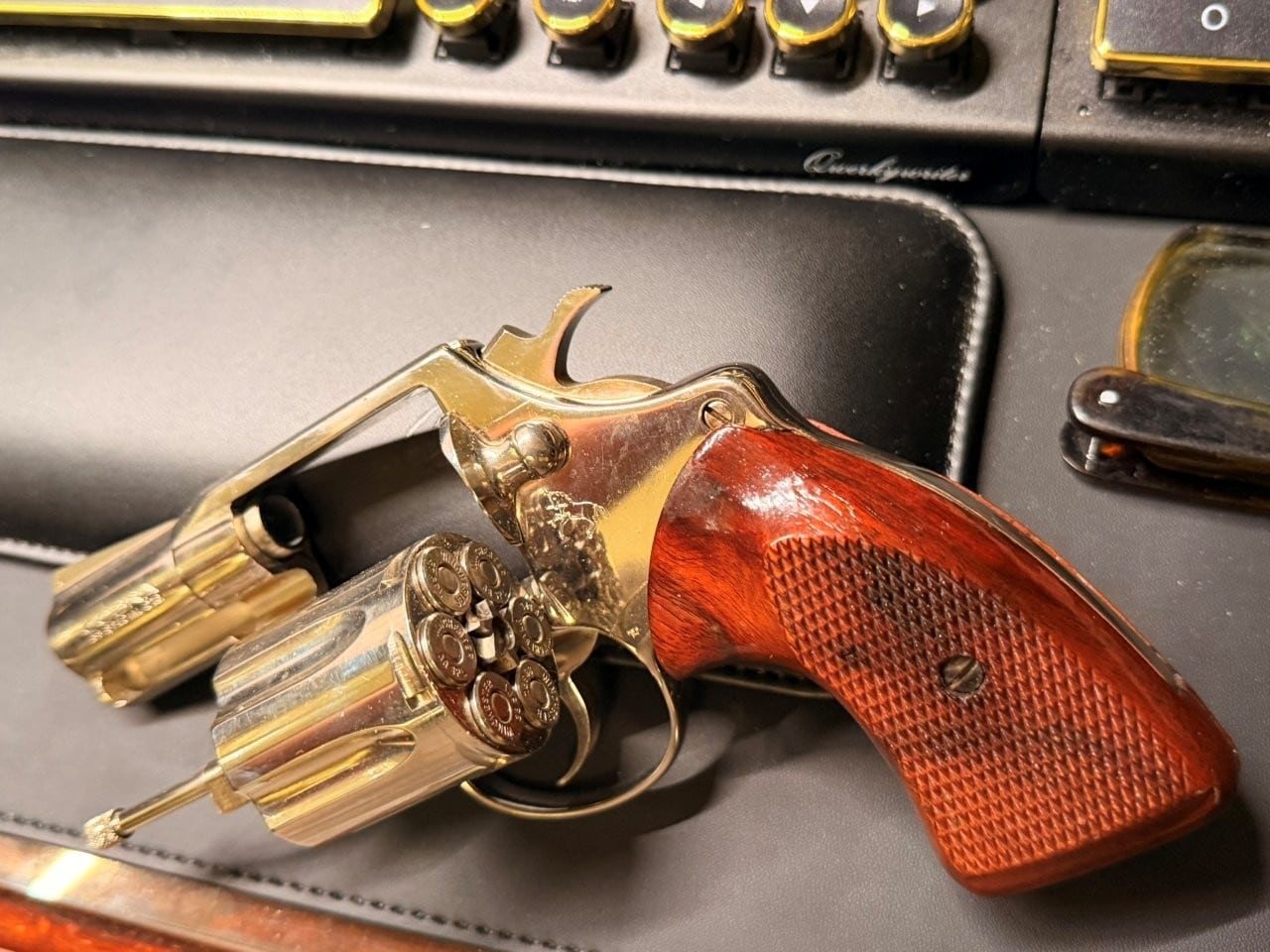 Colt Cobra with cylinder open showing ejector rod and cylinder details