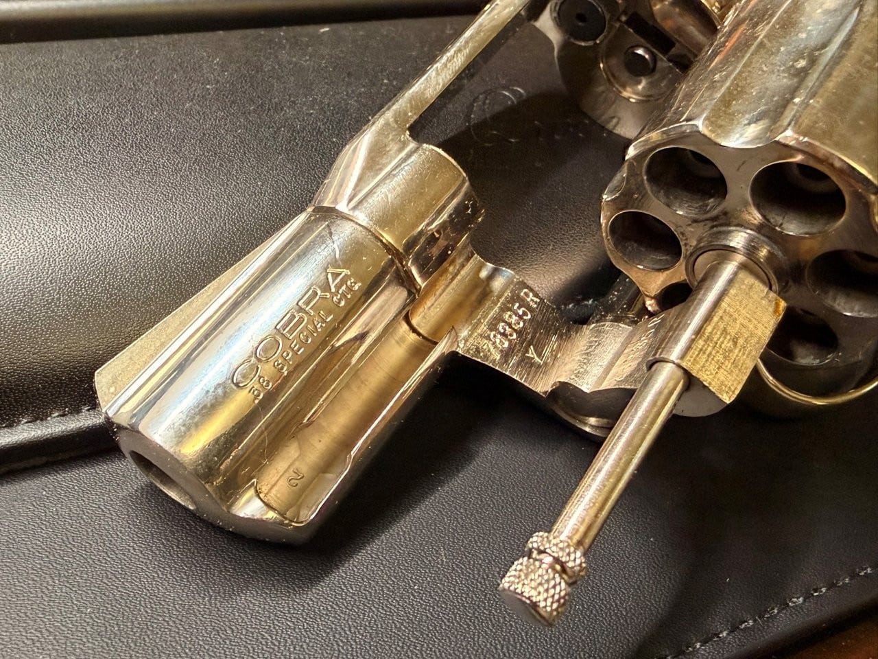 Open Colt Cobra showing crane and yoke area serial number inspection point