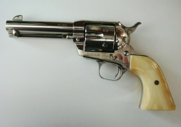 Left side view of 45 Colt Single Action Army Peacemaker with elephant ivory grips