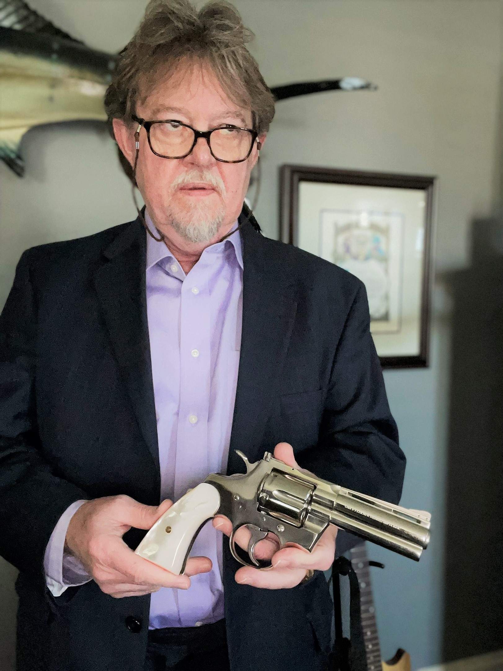 author holding a colt handgun