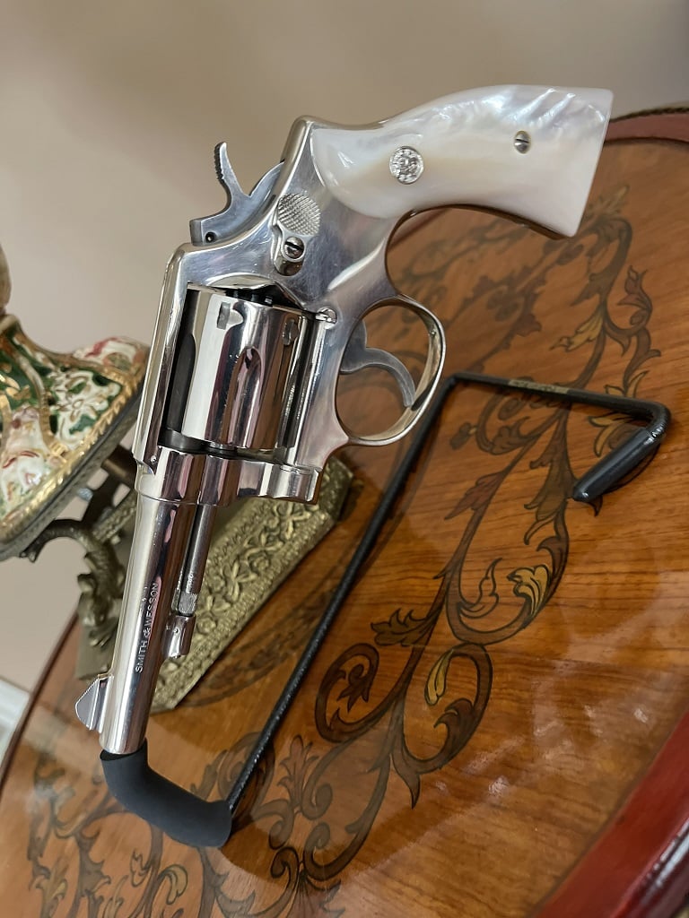 Smith & Wesson Model 10 with four inch pinned and tapered barrel