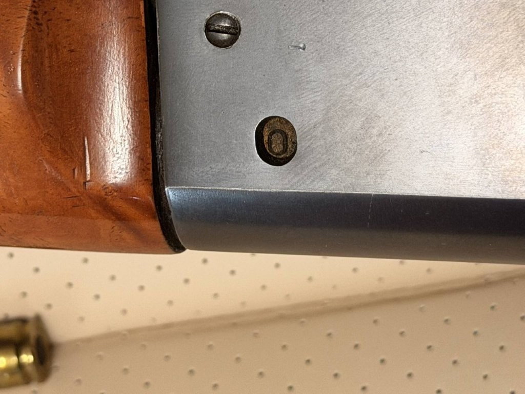 Savage Model 99 receiver showing the rotary magazine counter near the lever and safety area