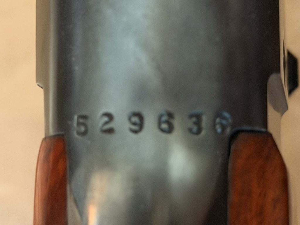 Close-up of a Savage Model 99 serial number and receiver markings