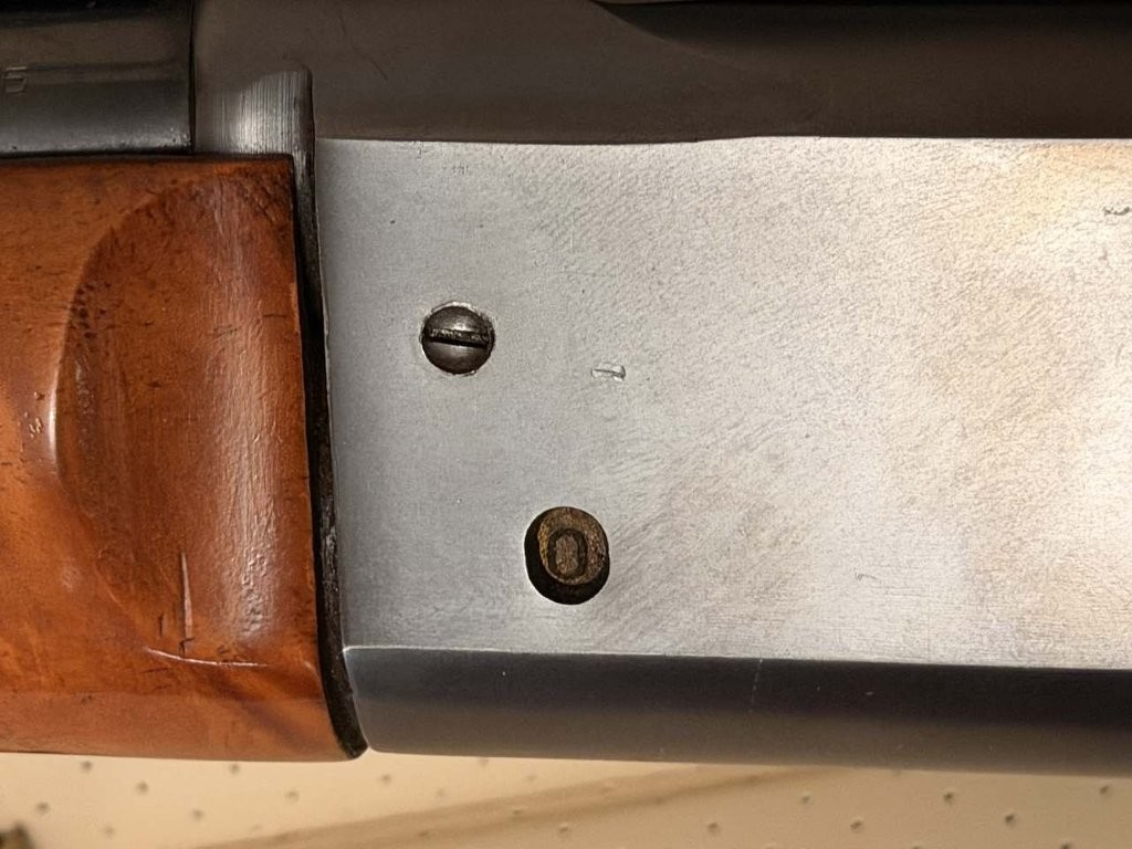 Close-up of Savage Model 99 brass rotary magazine cartridge counter
