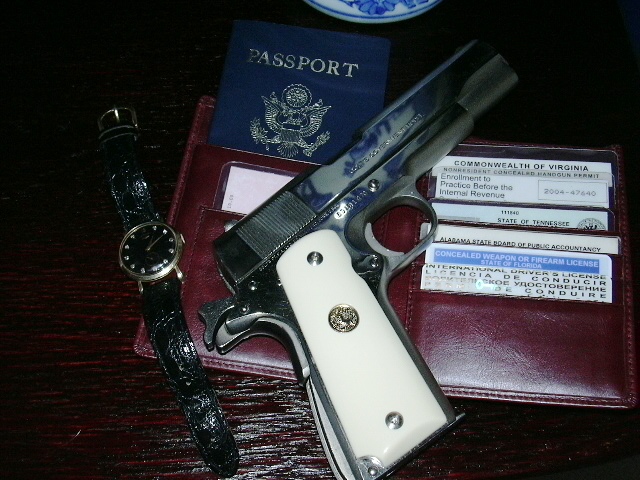 1911 Colt Government Model with watch and wallet