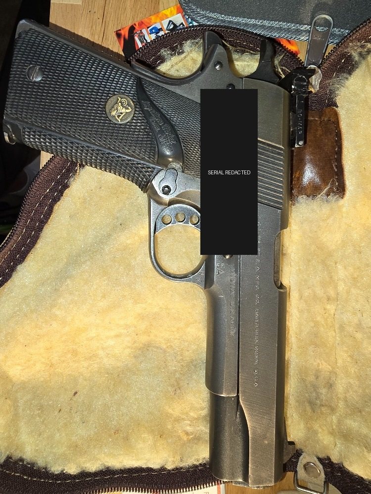 Opposite side of the Taylor Colt match pistol with government and arsenal markings