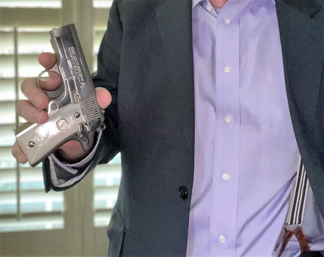 Author holding .380 Caliber Colt Mustang Semi-Automatic Pistol