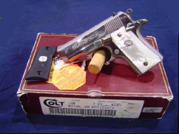 Colt Mustang with original box and extra shooter grips
