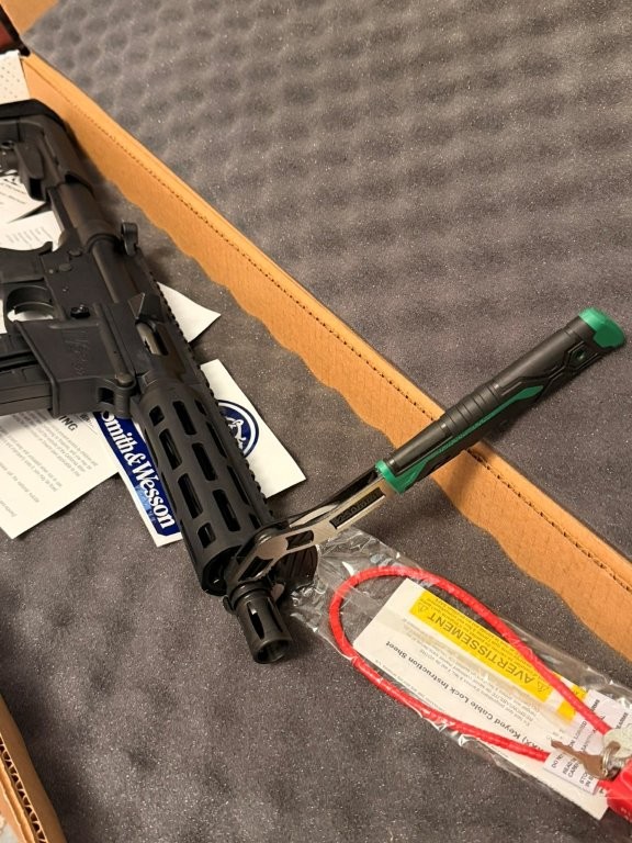 Adjustable wrench and muzzle device area