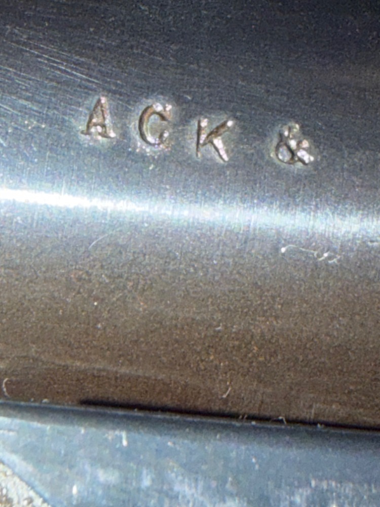 Gary’s September 8 close-up showing the A C K barrel letters and separate trailing symbol