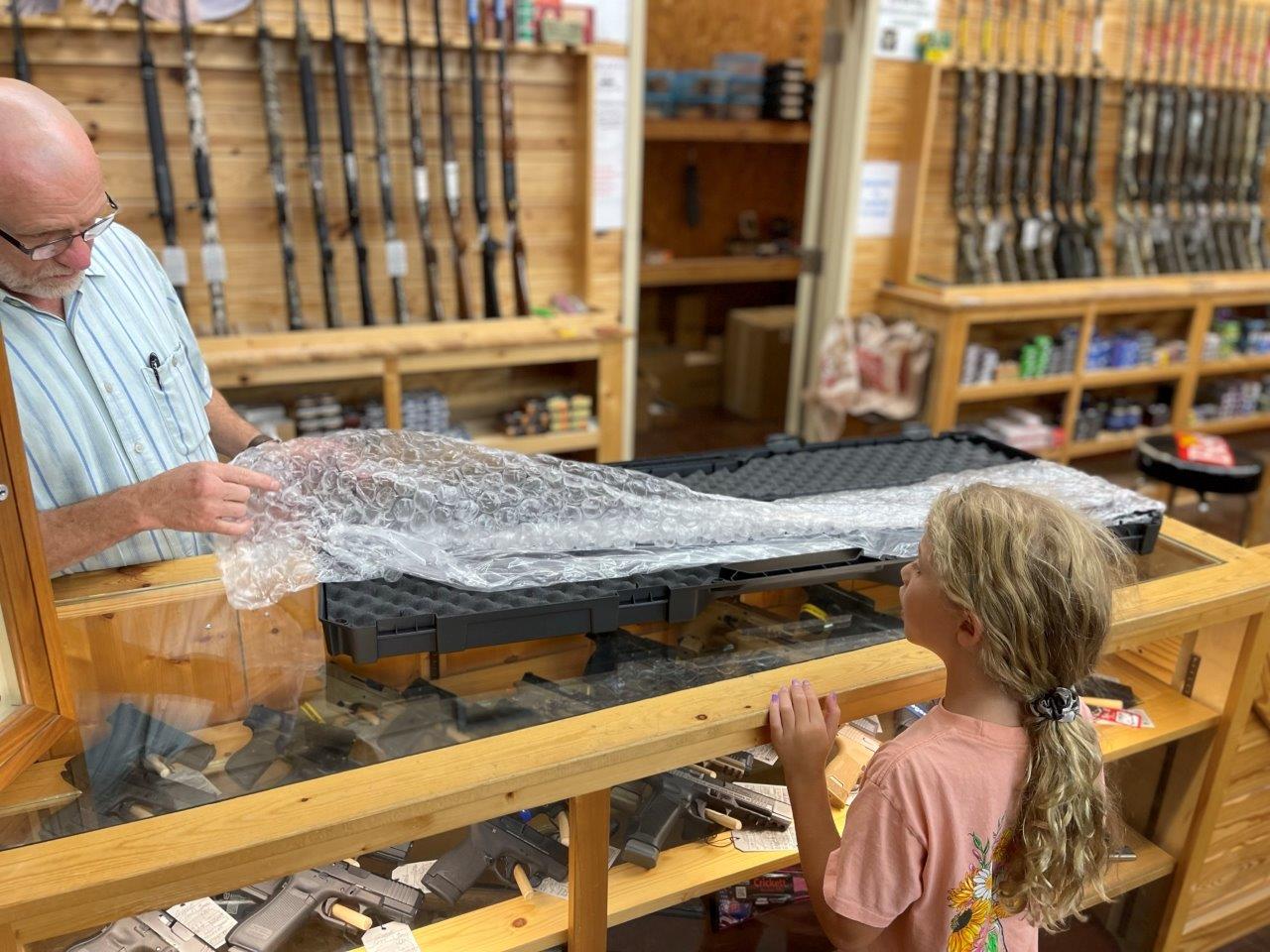 granddaughter looking at winchester model 42 when it arrived at my ffl